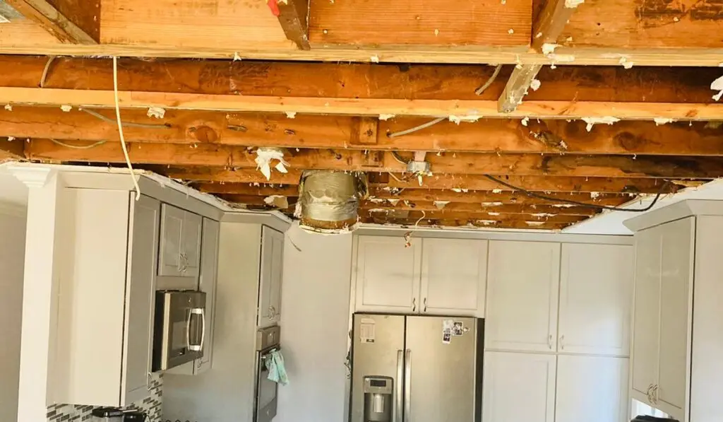 pipe bursting causing damage to the kitchen ceiling