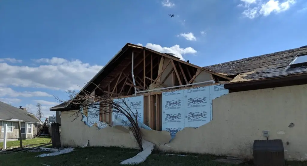 Tornado Damaged Roof and stucco wall