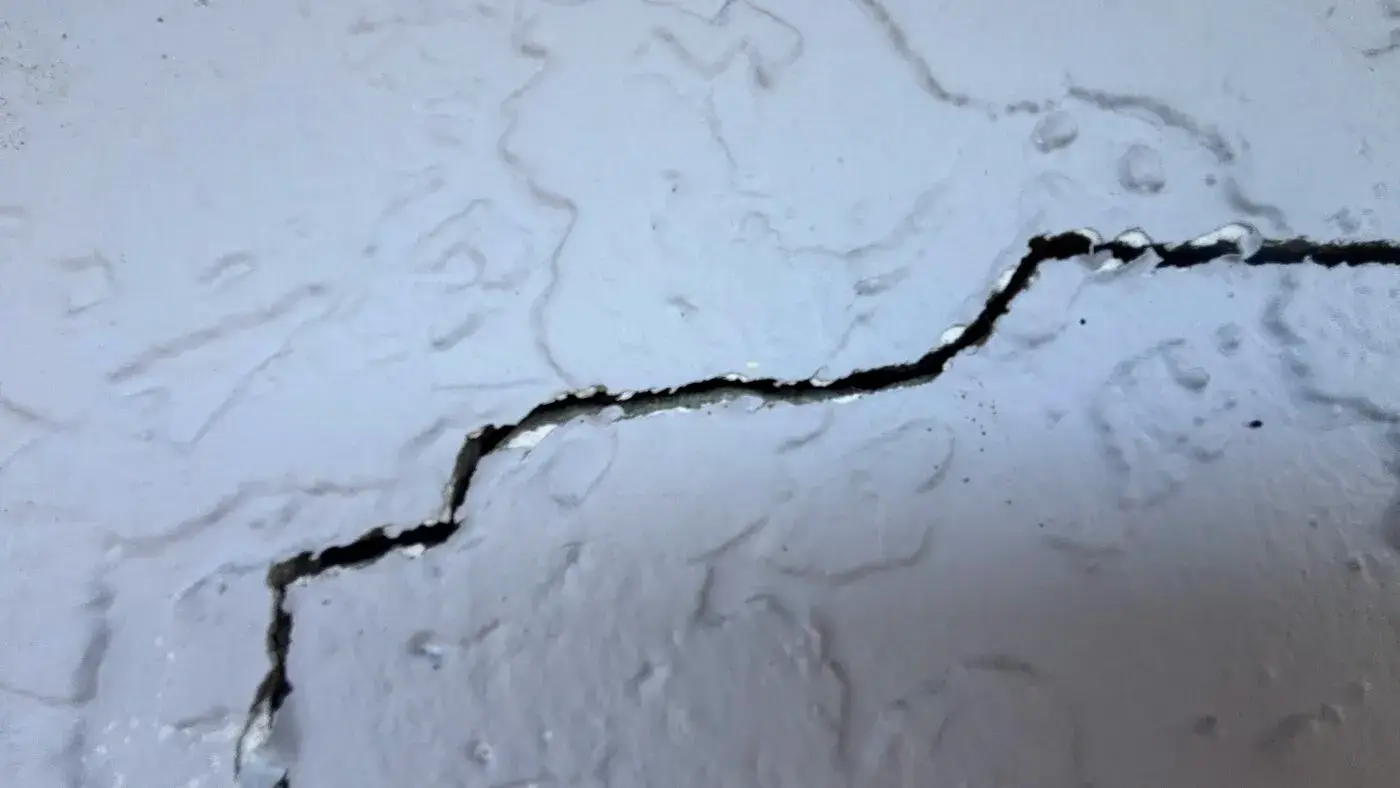 Large crack in an interior wall after property damage